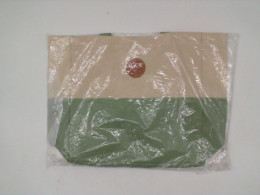 Cream colored cloth bag with green pattern