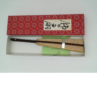 Light green Japanese fan in a red box