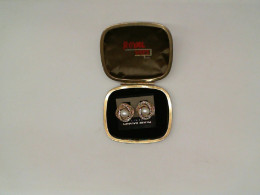 Gold earrings with beads in a white box Gold earrings with beads in a white box