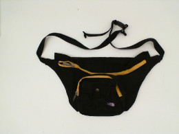 Black waist bag with yellow zip