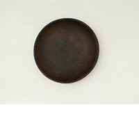 Dark brown ceramic coffee saucer