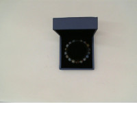 Purple beaded bracelet in a blue box