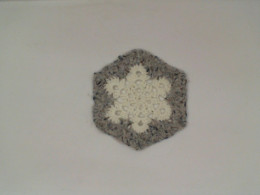 White snow coaster with grey pattern