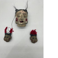 Set of 3 The doll has a human face. 