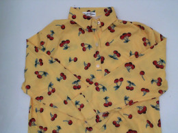 Yellow long-sleeved shirt with red cherry hem Size L