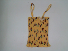 Yellow strapless tank top with red pattern 