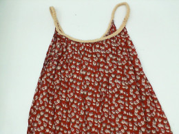 Red one-shoulder maxi dress with white floral pattern 