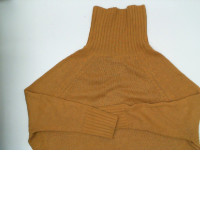 Orange knitted turtleneck sweater Orange knitted turtleneck sweater