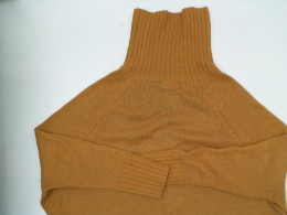 Orange knitted turtleneck sweater Orange knitted turtleneck sweater