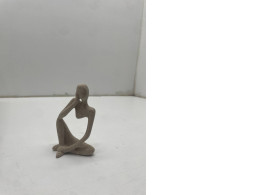 Souvenir figurine in the form of a woman