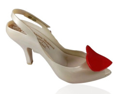 Women's white shoes with a heart