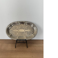 Oval metal plate on stand