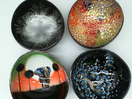 Set of 4 Coconut shells are decorated with beautiful patterns.  