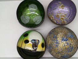 Set of 4 Coconut shells are decorated with beautiful patterns.  