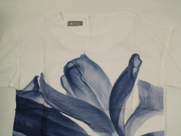 Women's white round neck shirt with blue floral pattern Women's white round neck shirt with blue floral pattern