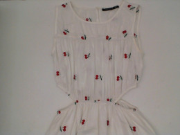 Long white dress with red cherry pattern