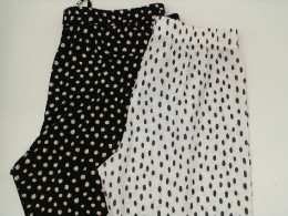 Set of 2 Black pants with white polka dots and white pants with black polka dots