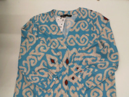 Long blue button-up dress with cream pattern 