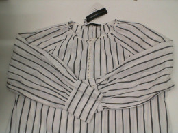 Women's long-sleeved white dress with black stripes Women's long-sleeved white dress with black stripes