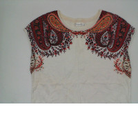 White sleeveless shirt with red pattern White sleeveless shirt with red pattern