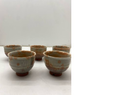 Set of 5 Drink Chinese tea with light orange color. 
