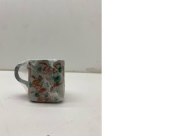 Japanese ceramic coffee mug with cherry blossom pattern