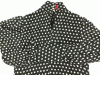 Women's long-sleeved round neck shirt in black with white polka dots 