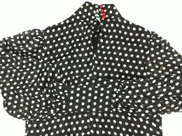 Women's long-sleeved round neck shirt in black with white polka dots Women's long-sleeved round neck shirt in black with white polka dots