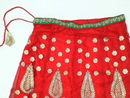 Long red skirt with gold pattern 