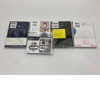 Set of 4 Japanese comic books, 1 badge, 1 acrilyc stand Set of 4 Japanese comic books, 1 badge, 1 acrilyc stand