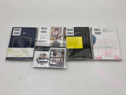 Set of 4 Japanese comic books, 1 badge, 1 acrilyc stand