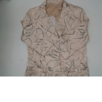 Women's cream colored suit with black pattern 