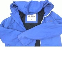 Blue hoodie with zip-up, blue Hollister logo pattern