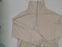 Women's cream turtleneck workout top 