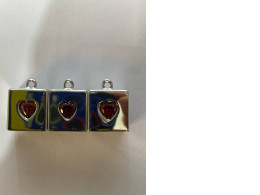 Set of 3 Square pendant necklace with a red heart in the center. Set of 3 Square pendant necklace with a red heart in the center.