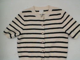 White short sleeve round neck button-up shirt with black stripes White short sleeve round neck button-up shirt with black stripes