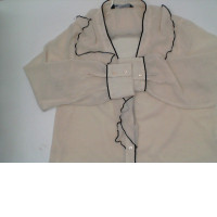 Women's cream-colored, long-sleeved, V-neck shirt with black stripes 