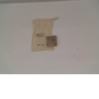 Small bar of soap in a small cream colored cloth bag Small bar of soap in a small cream colored cloth bag