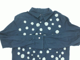 Blue long-sleeved shirt with white polka dots