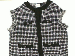 Women's sleeveless shirt with white buttons and black stripes Women's sleeveless shirt with white buttons and black stripes