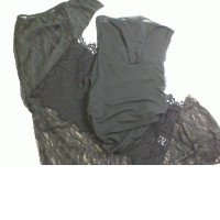 Women's 3-piece suit. Sheer lace skirt, white top with black lace, sheer bodysuit