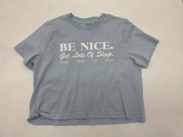 Light blue women's t-shirt with BE NICE print