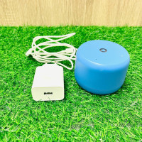 Blue Bluetooth speaker with charging cable