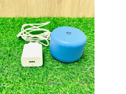 Blue Bluetooth speaker with charging cable