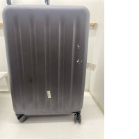 Gray rolling suitcase