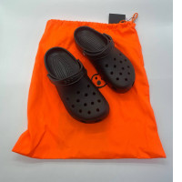 Black crocs with bag
