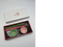 Set of 2 sets of sushi chopsticks and 2 sauce bowls