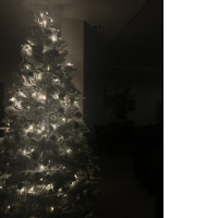 New Year's artificial tree complete with Christmas tree decorations and a stand in the form of twigs New Year's artificial tree complete with Christmas tree decorations and a stand in the form of twigs