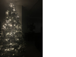 New Year's artificial tree complete with Christmas tree decorations and a stand in the form of twigs New Year's artificial tree complete with Christmas tree decorations and a stand in the form of twigs