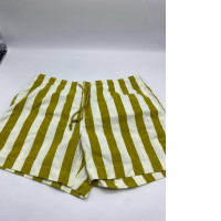 Women's green shorts with white stripes